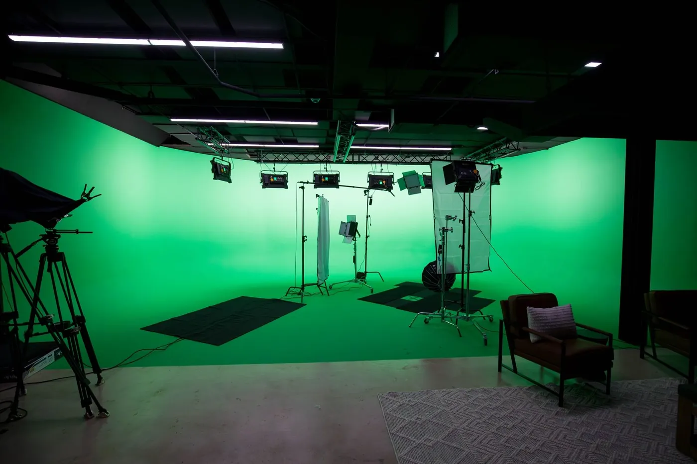 Wide view of the green screen stage and overhead lighting